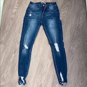 Dark wash destroyed high rise jeans